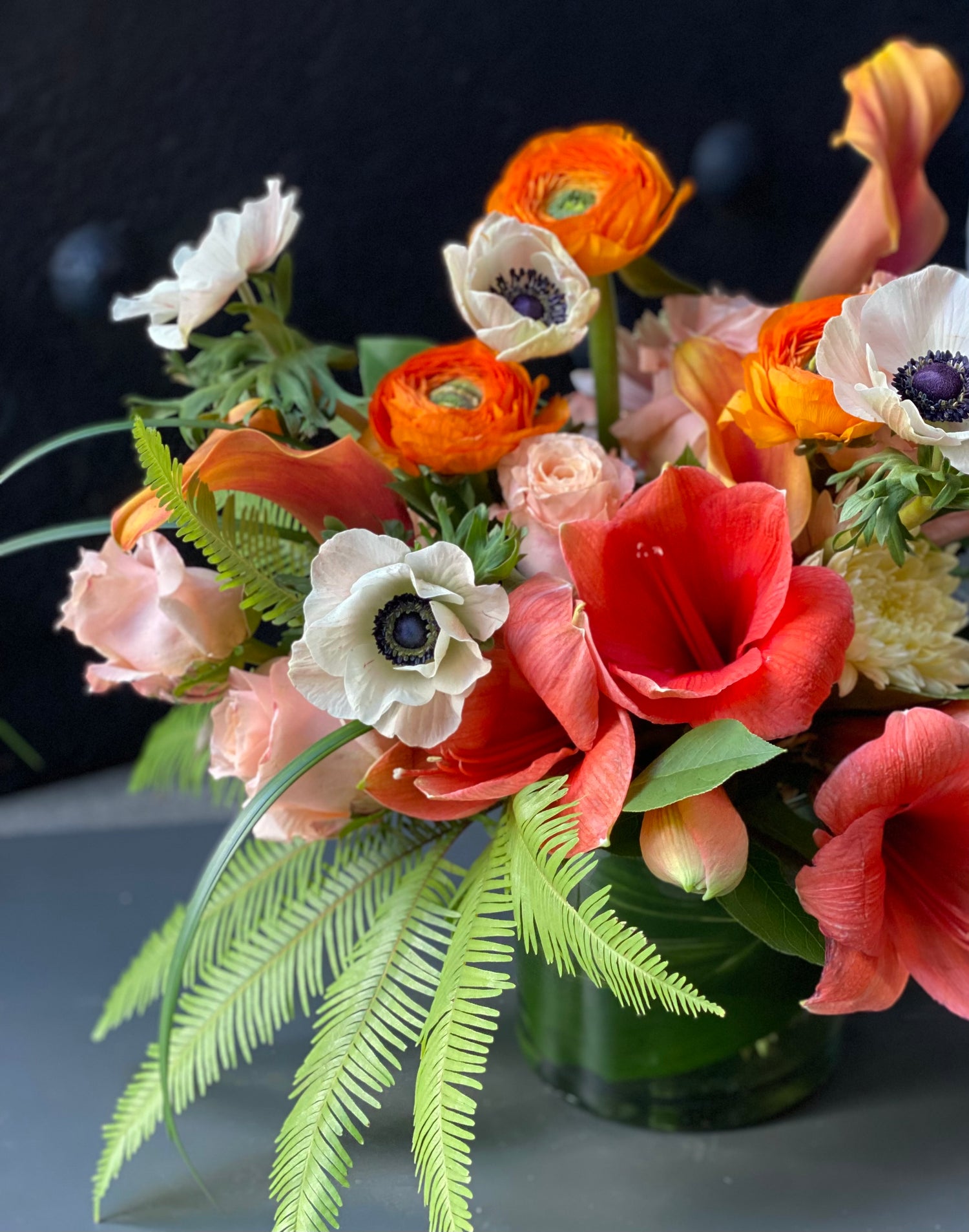 see! Magic Anemones their petals unfold, with rubies flaming, and with living gold. the arrangement engages guests in the magical worlds of the elegant ranunculus and belladonna lilies. 