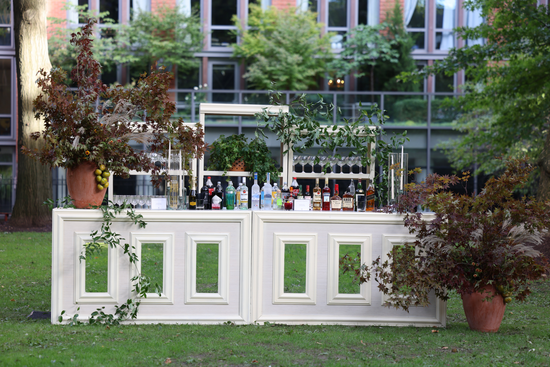outdoor bar with flowers at  Chelsea Square Hotel event by RHC